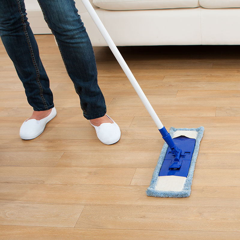 Woman wet mopping Hardwood Floor | The L&L Company