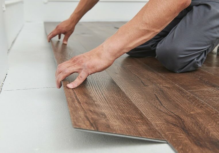 Luxury vinyl flooring being installed | The L&L Company