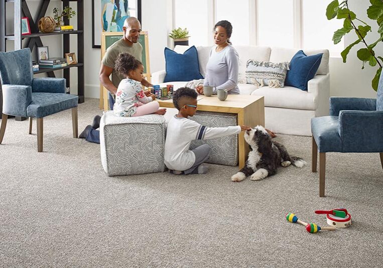 Preferred Flooring Provider Family enjoying new room with fresh carpet | The L&L Company